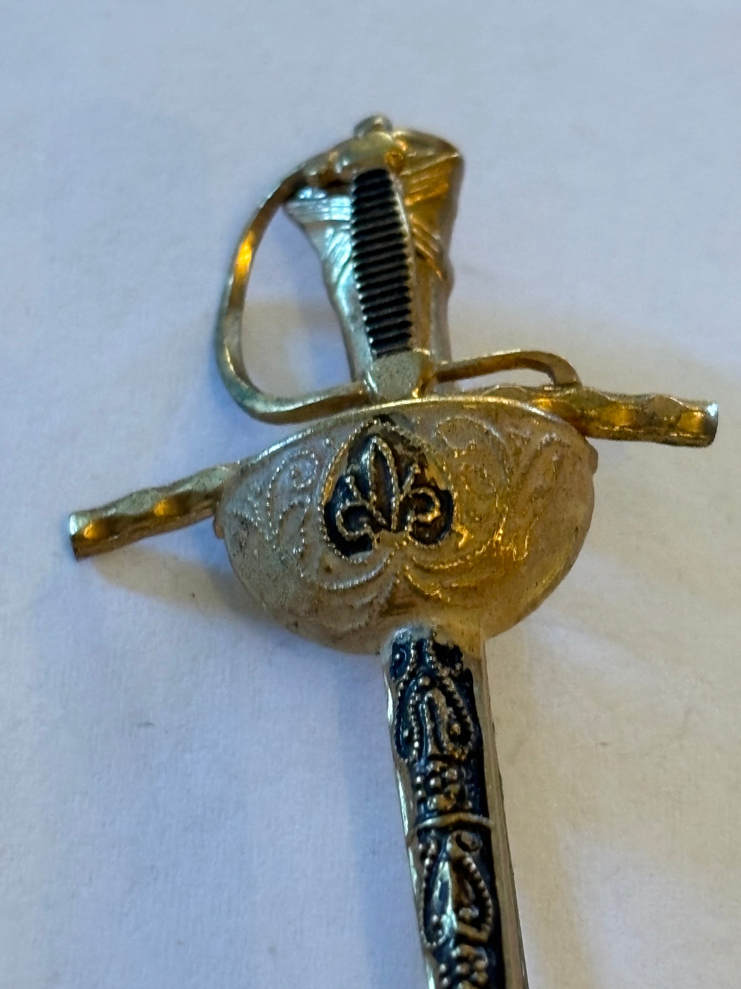 Vintage gold metal sword brooch