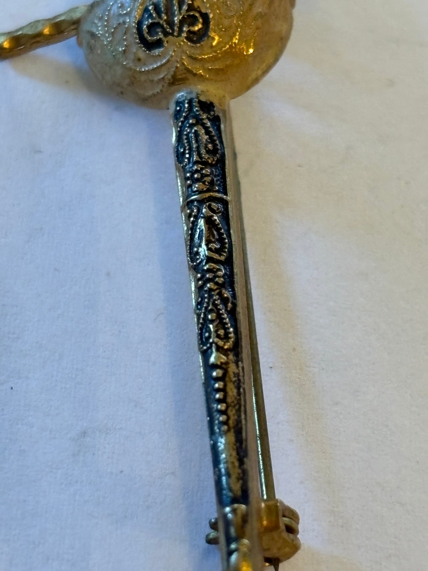 Vintage gold metal sword brooch