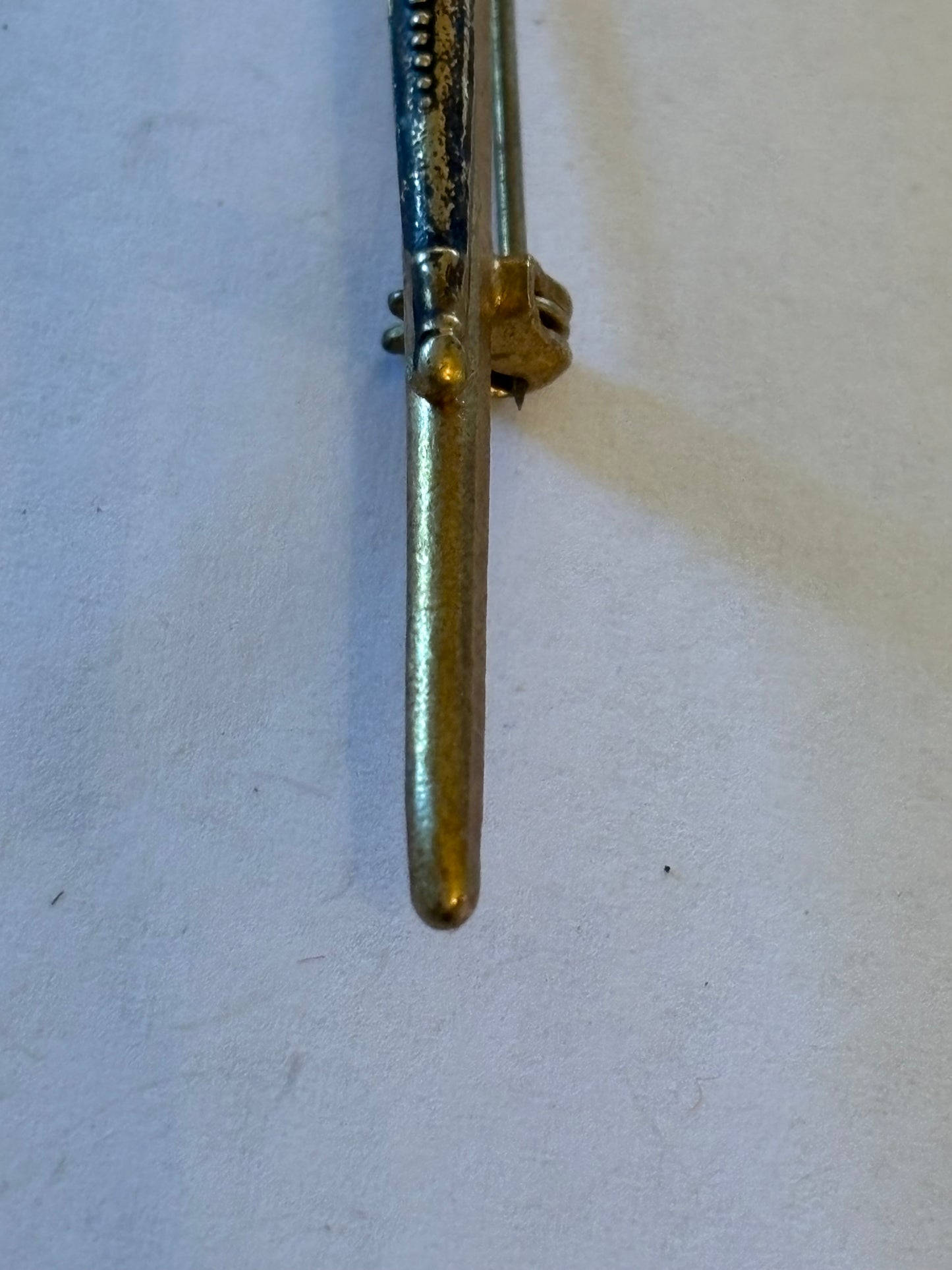 Vintage gold metal sword brooch