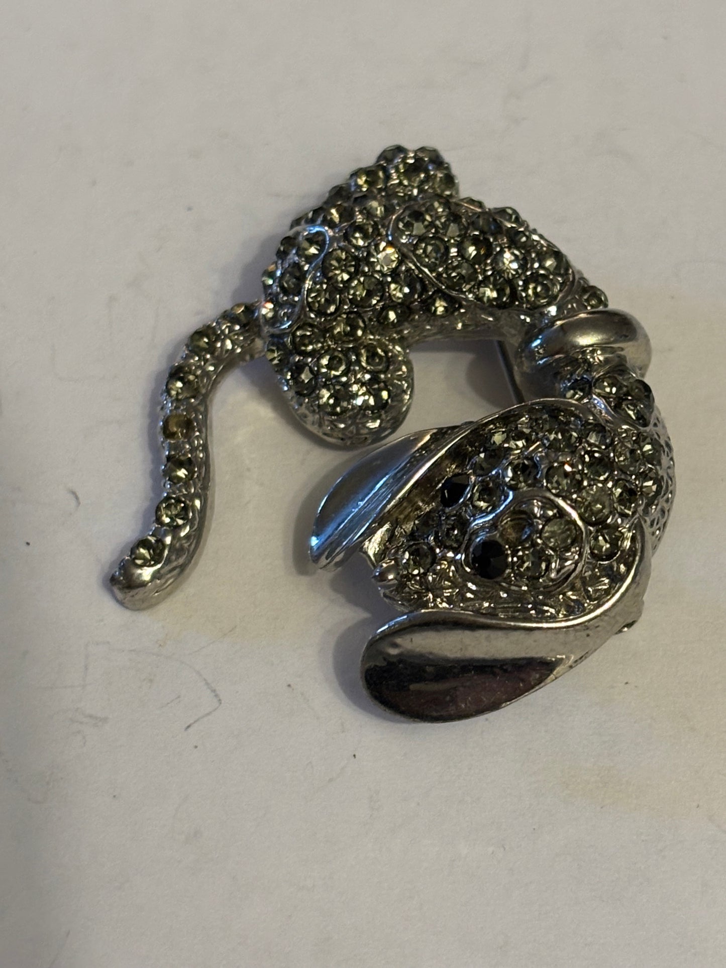 Sleeping puppy diamante silver brooch