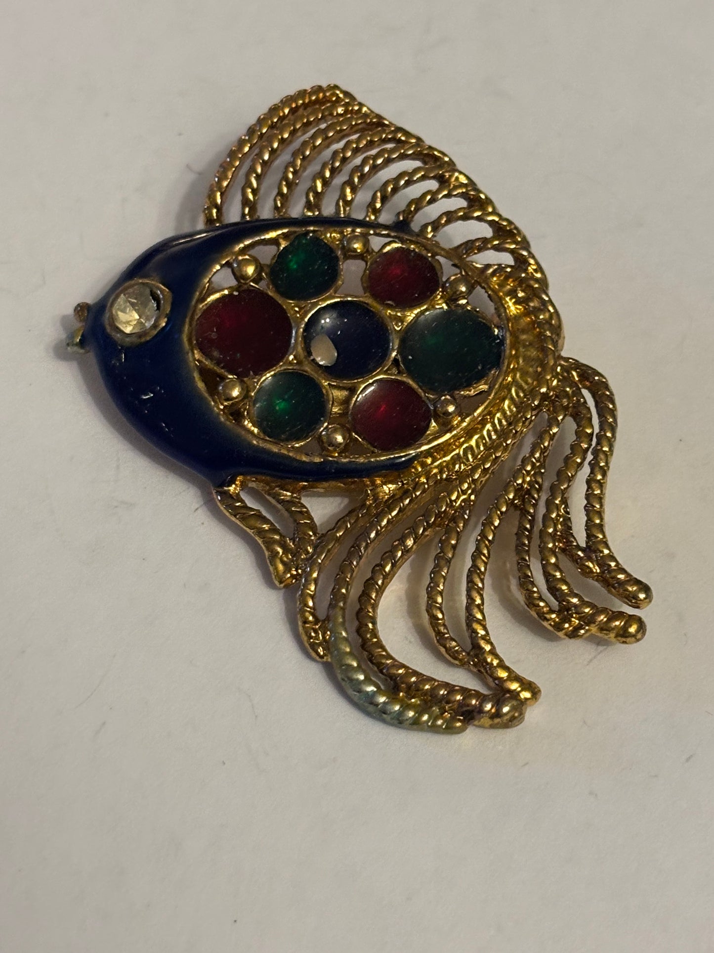 Large gold decorative fish brooch with coloured decoration