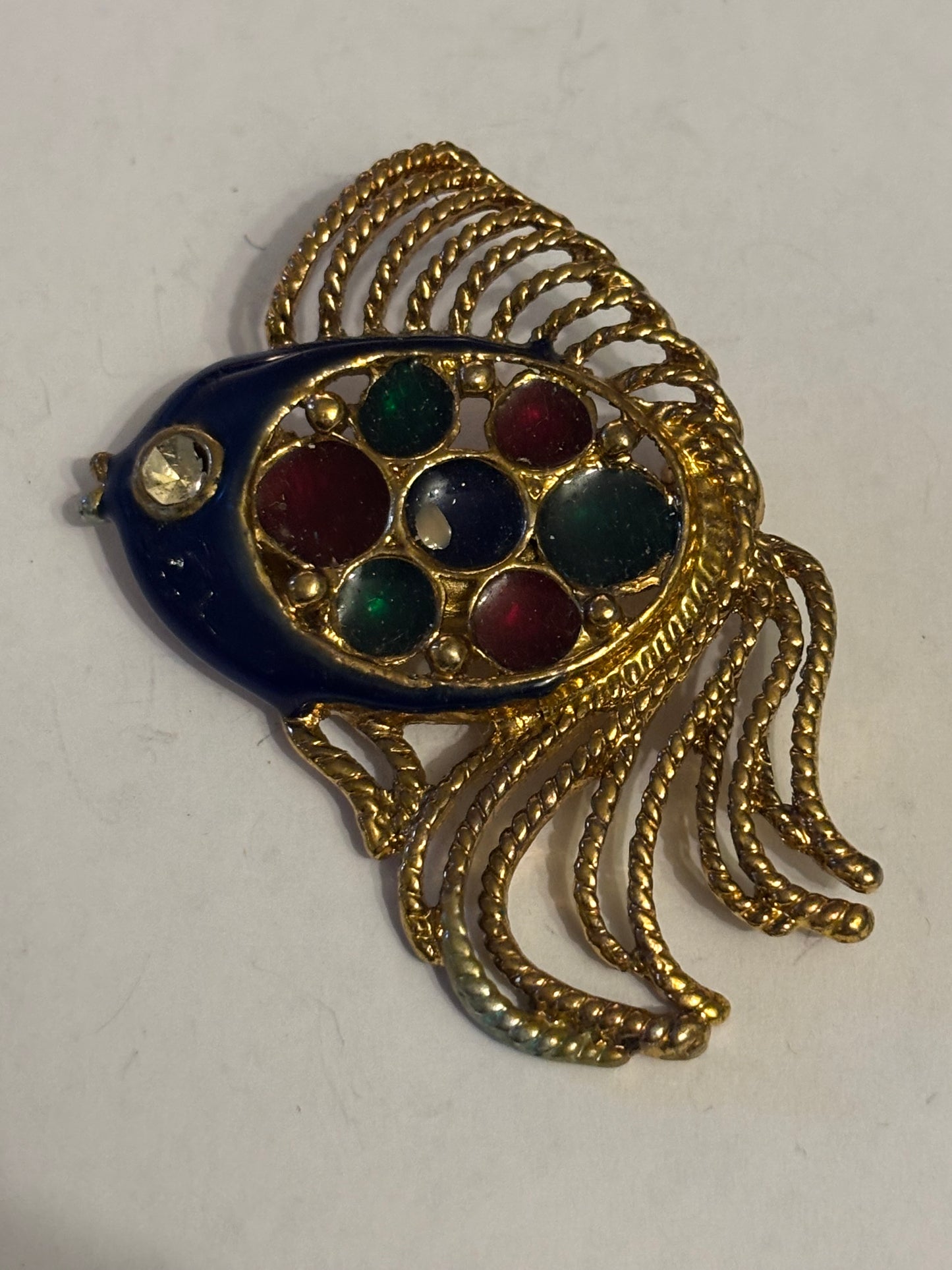 Large gold decorative fish brooch with coloured decoration