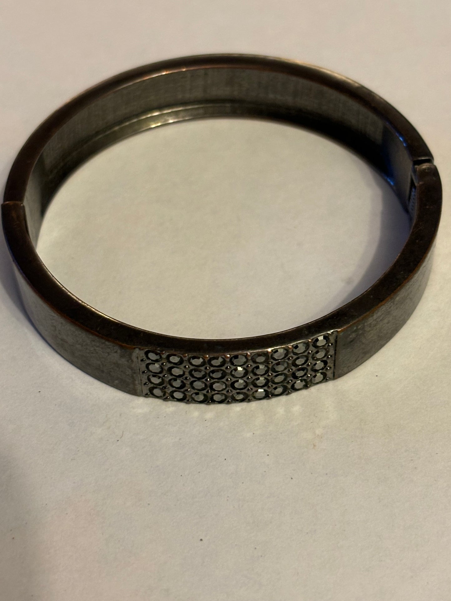 Dark Metal Spring Bangle with panel of dark diamantes