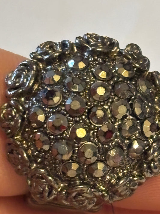 Dark silver metal stretch ring with dome of dark stones