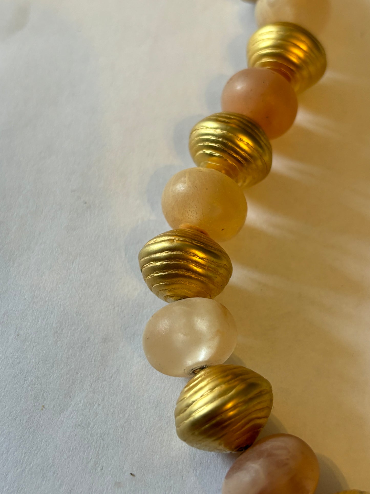 Large long gold and peach bead necklace