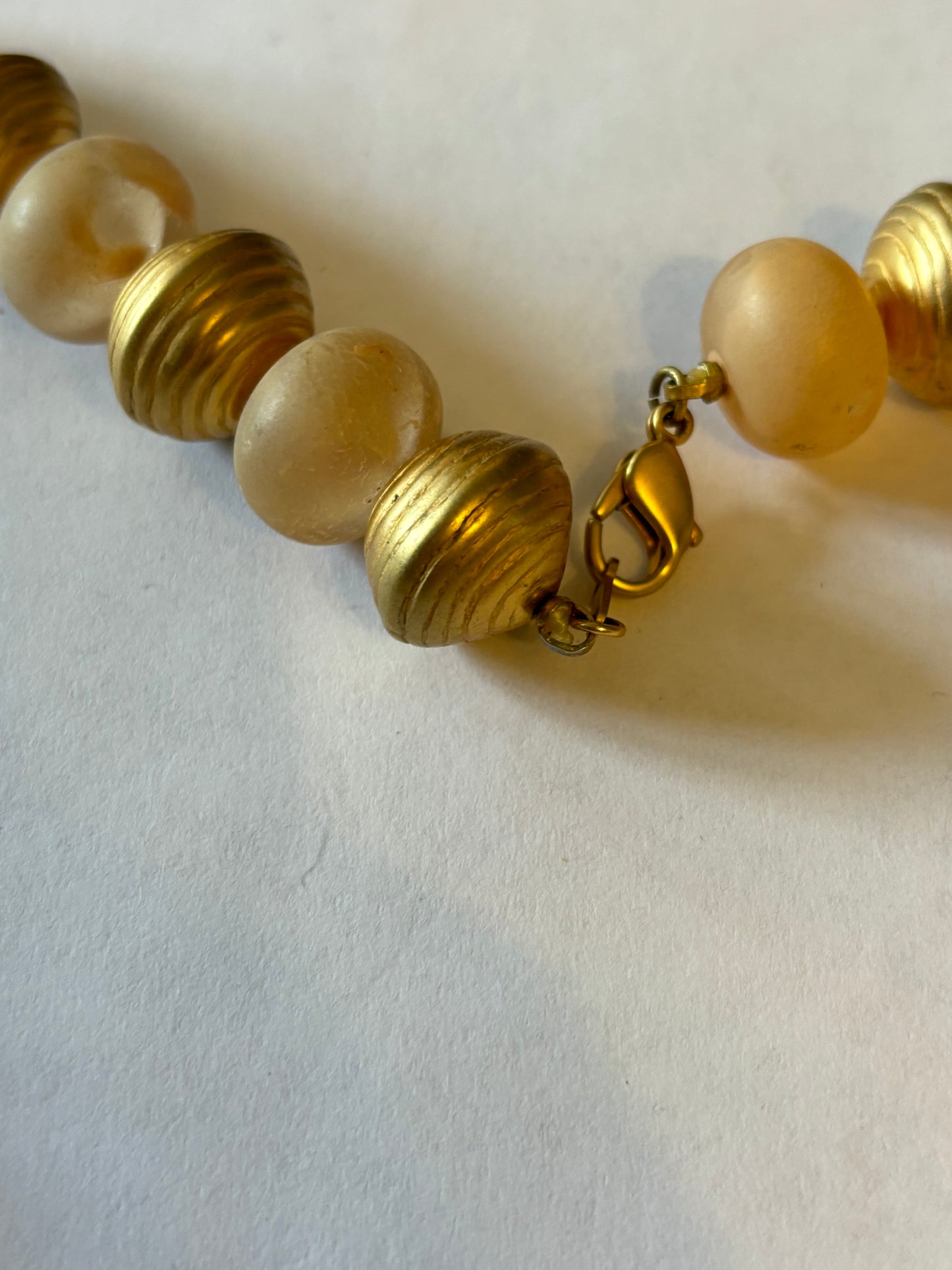 Large long gold and peach bead necklace