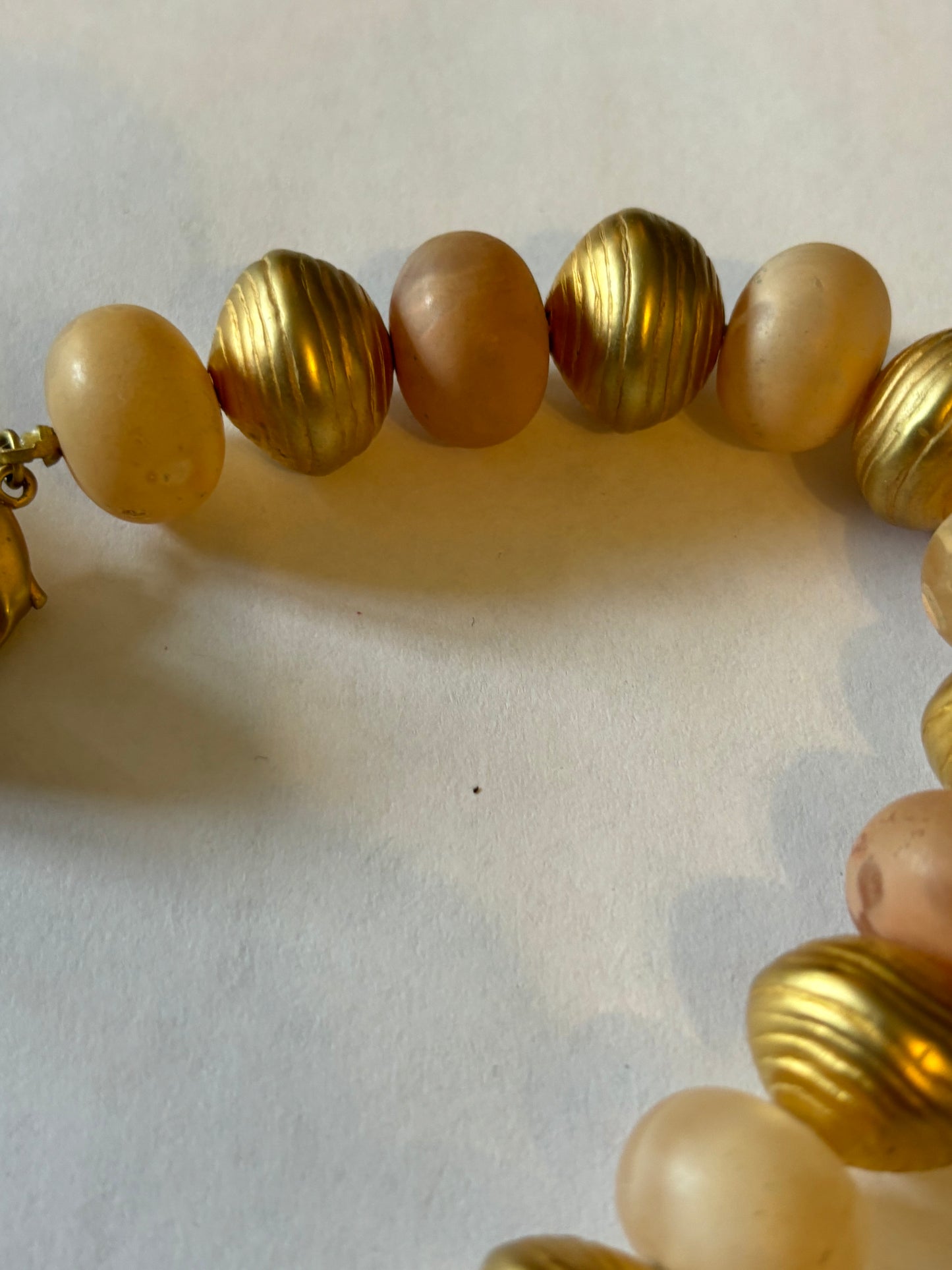 Large long gold and peach bead necklace