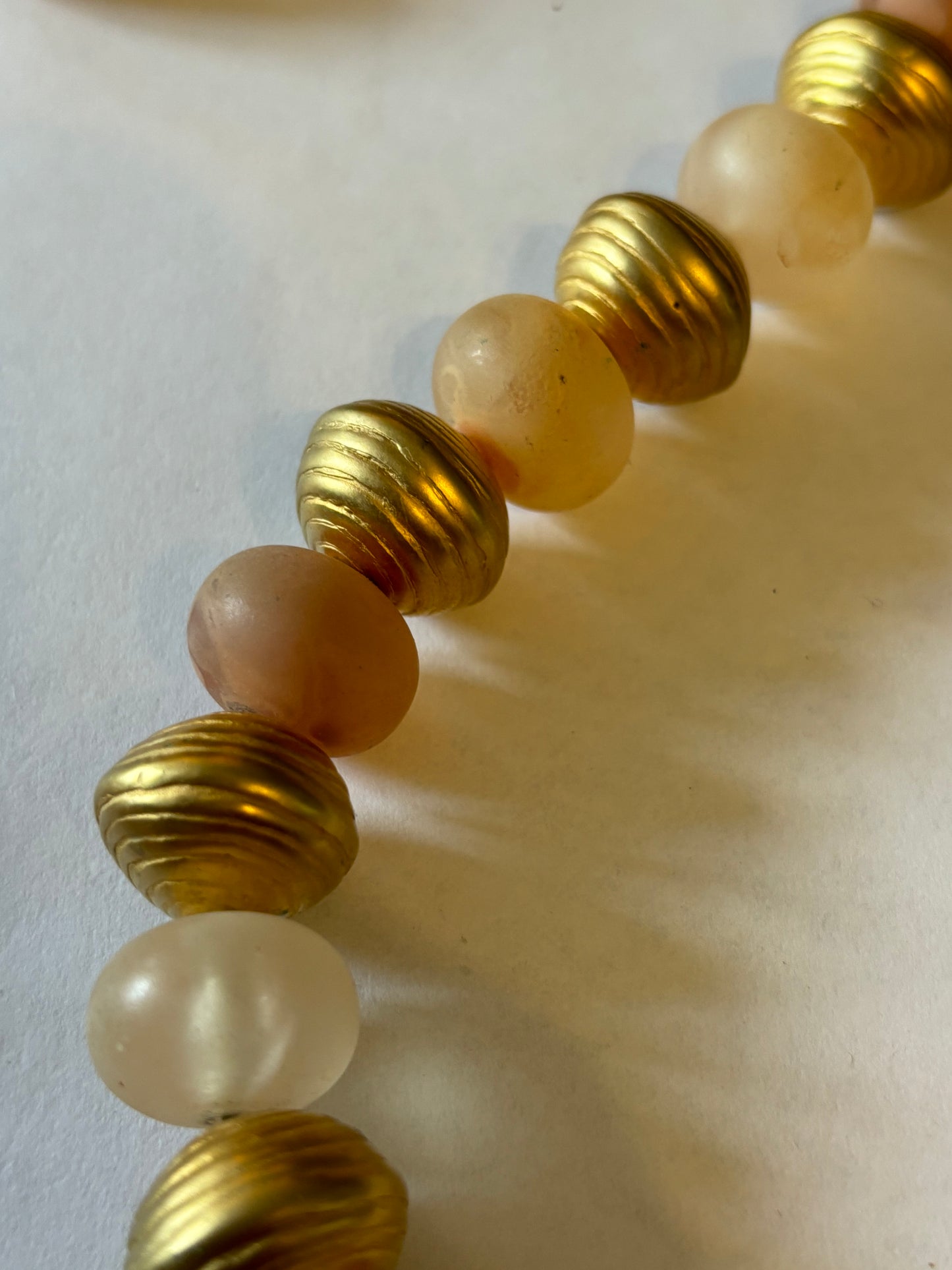 Large long gold and peach bead necklace