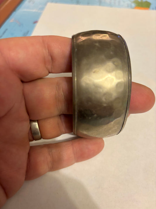 Silver metal wide bangle with light hammered pattern