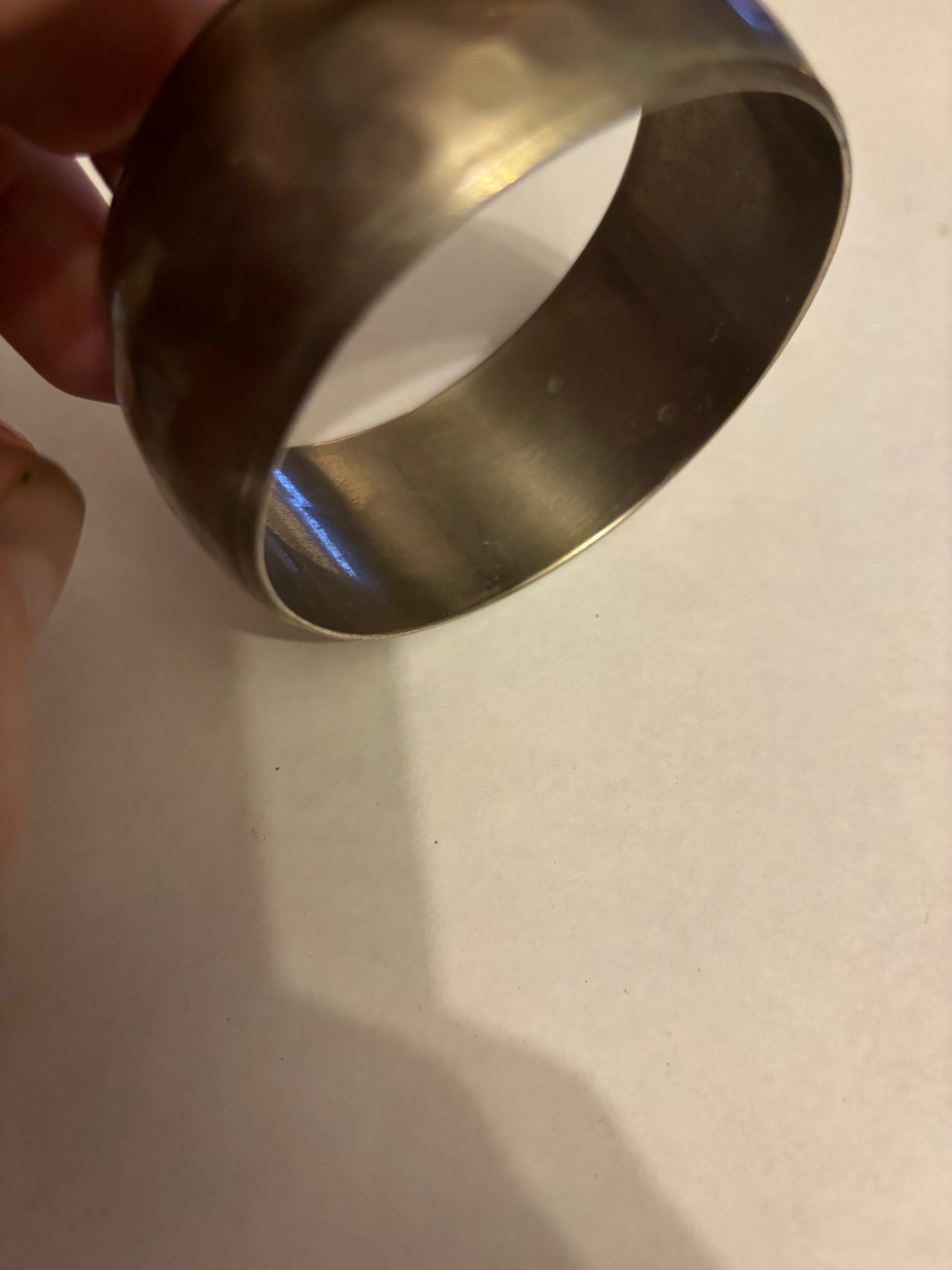 Silver metal wide bangle with light hammered pattern