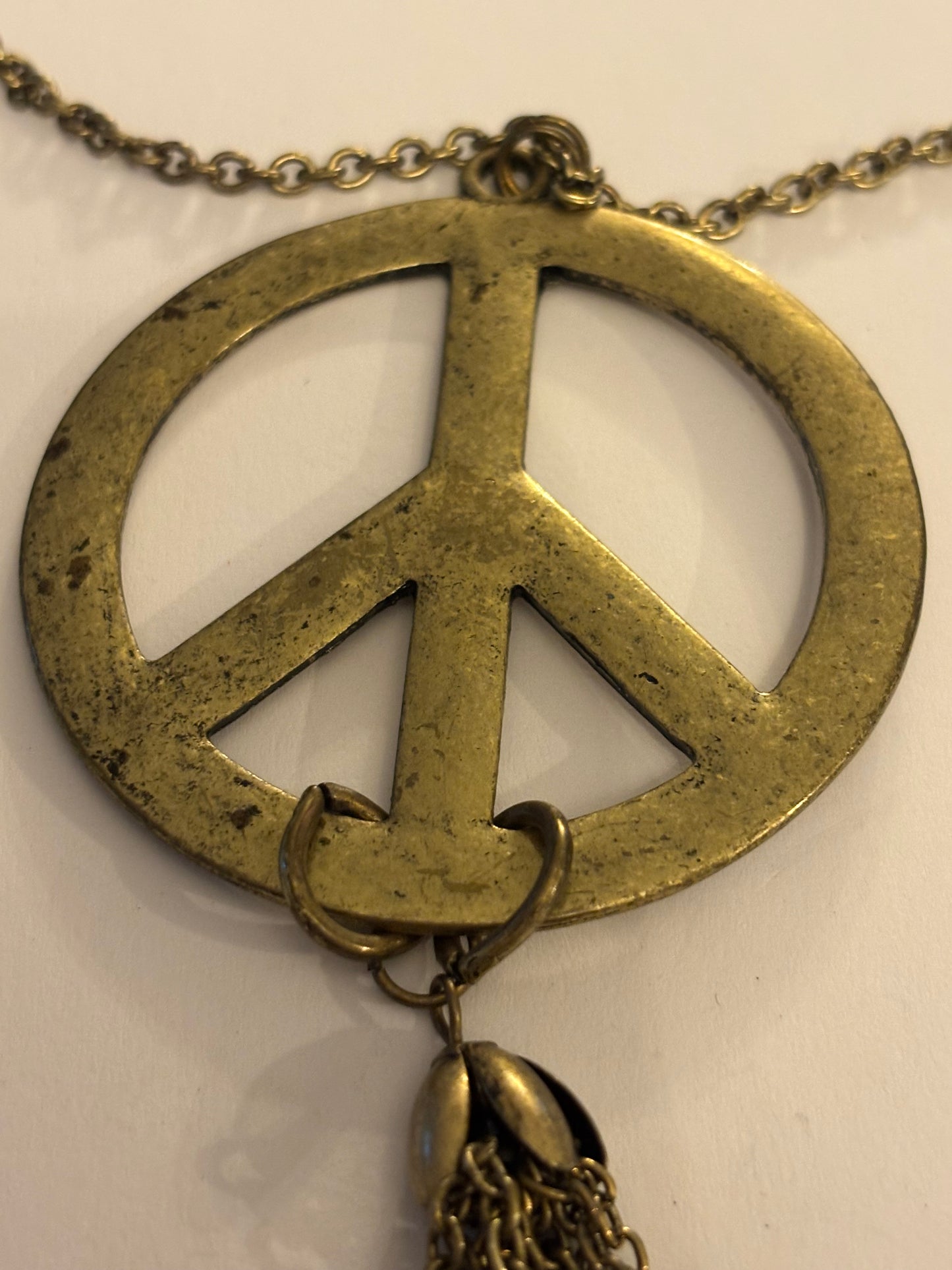 Long dark gold metal Peace symbol necklace