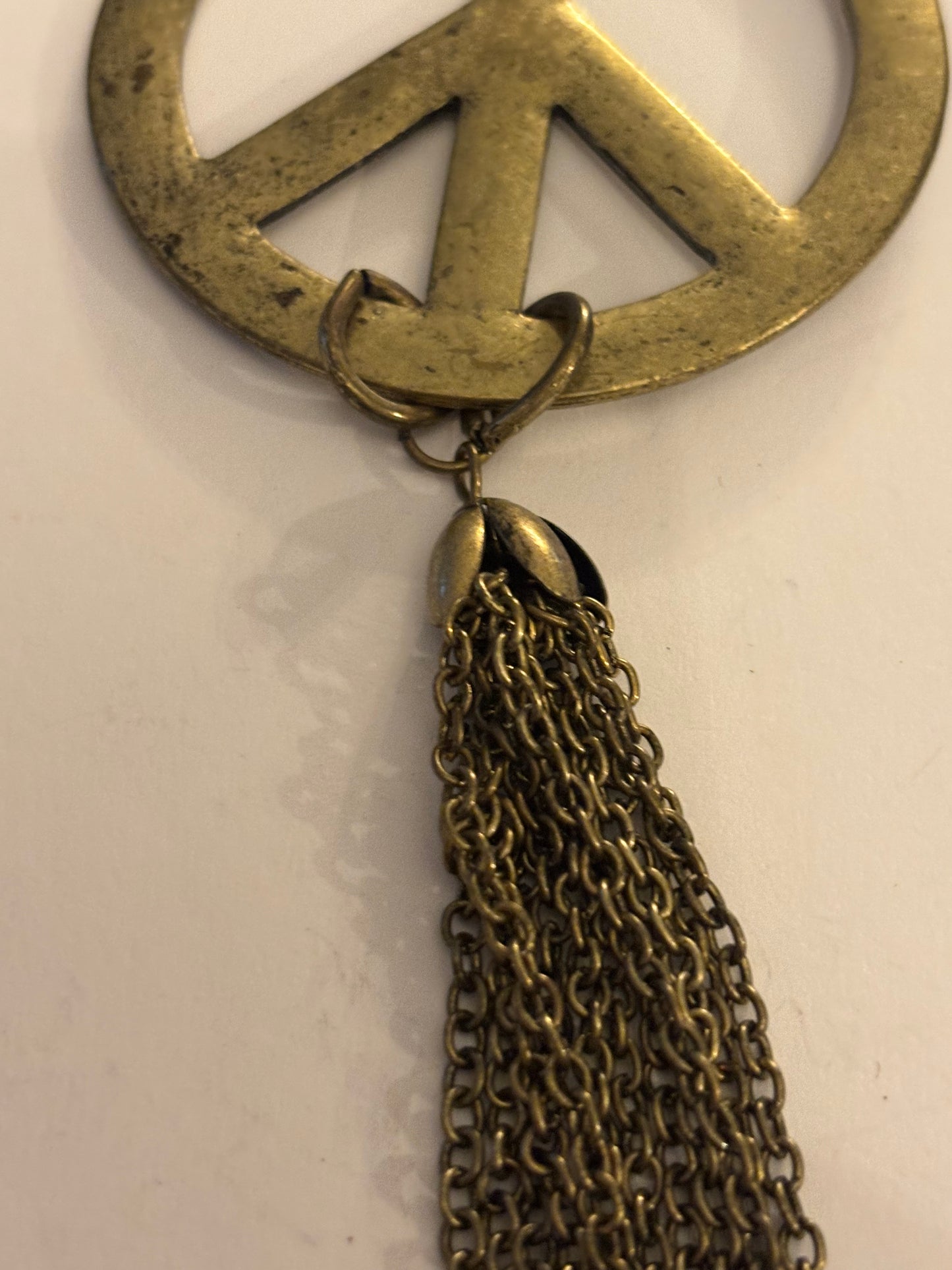 Long dark gold metal Peace symbol necklace