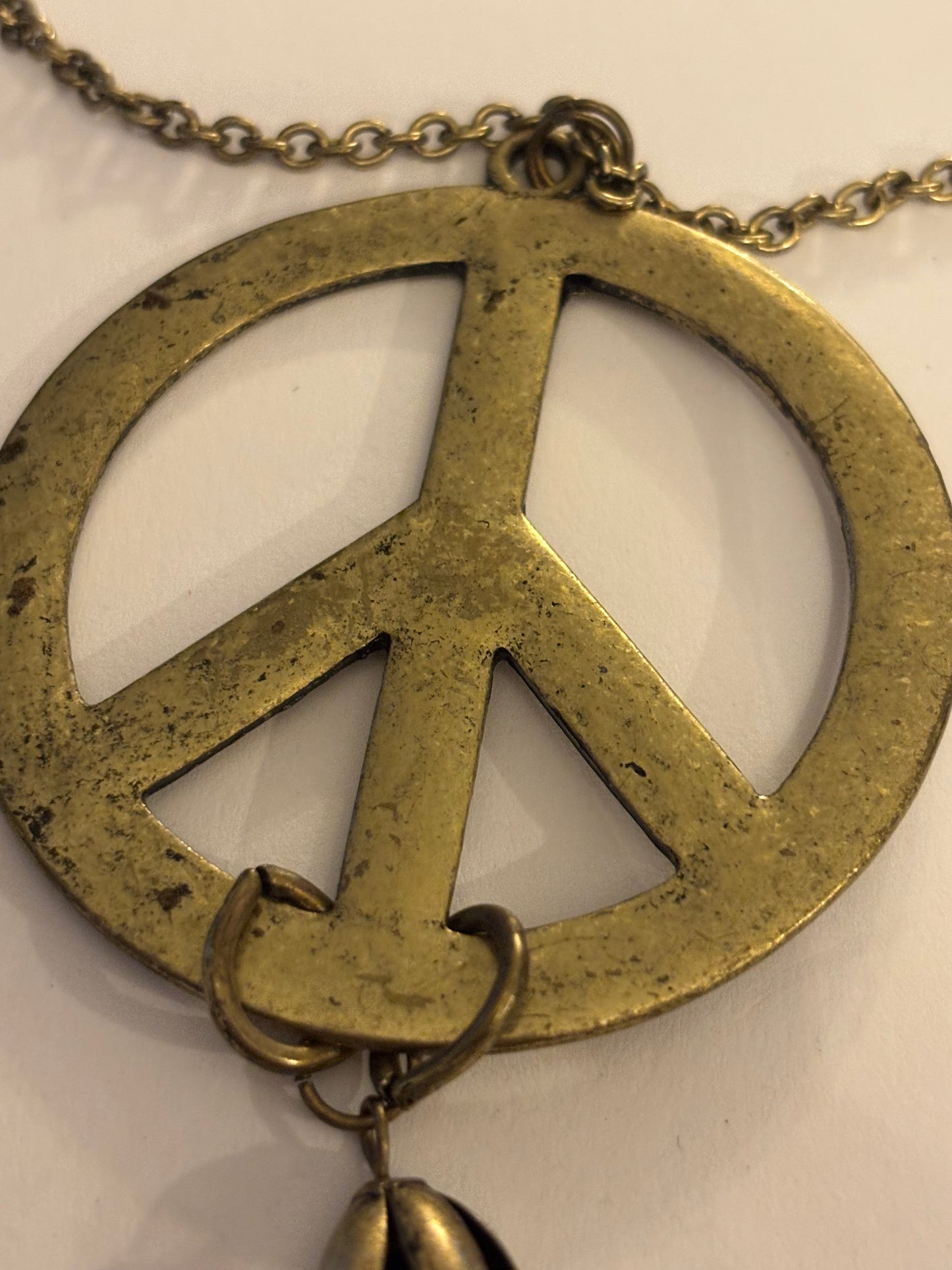 Long dark gold metal Peace symbol necklace