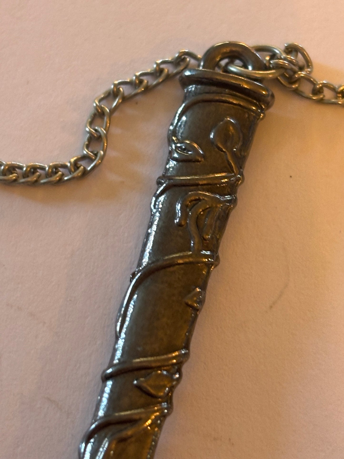 Long silver chain necklace with long sword sheath pendant