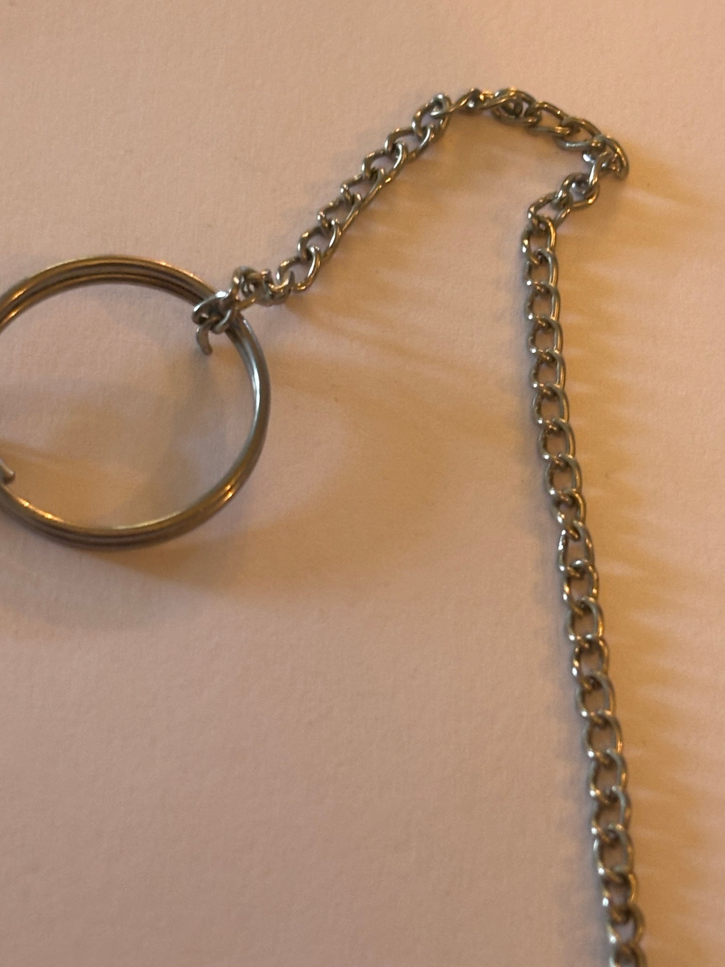 Long silver chain necklace with long sword sheath pendant