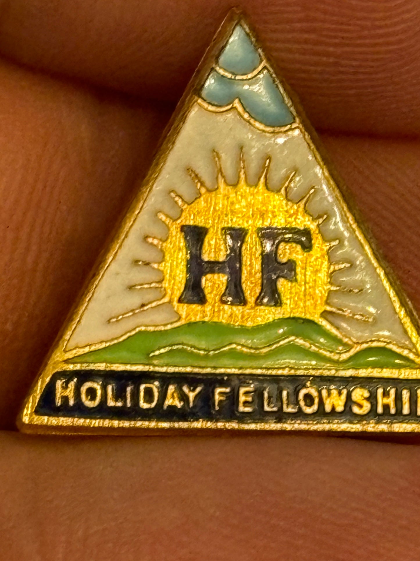 Small vintage triangular Holiday Fellowship pin badge