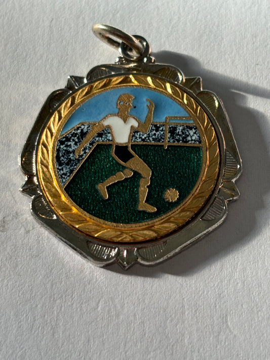 Small silver metal football medal