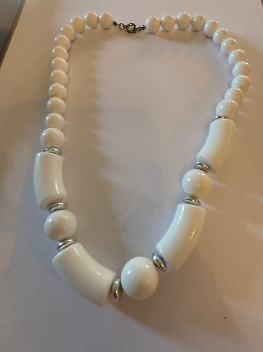 White and tube like large beaded necklace