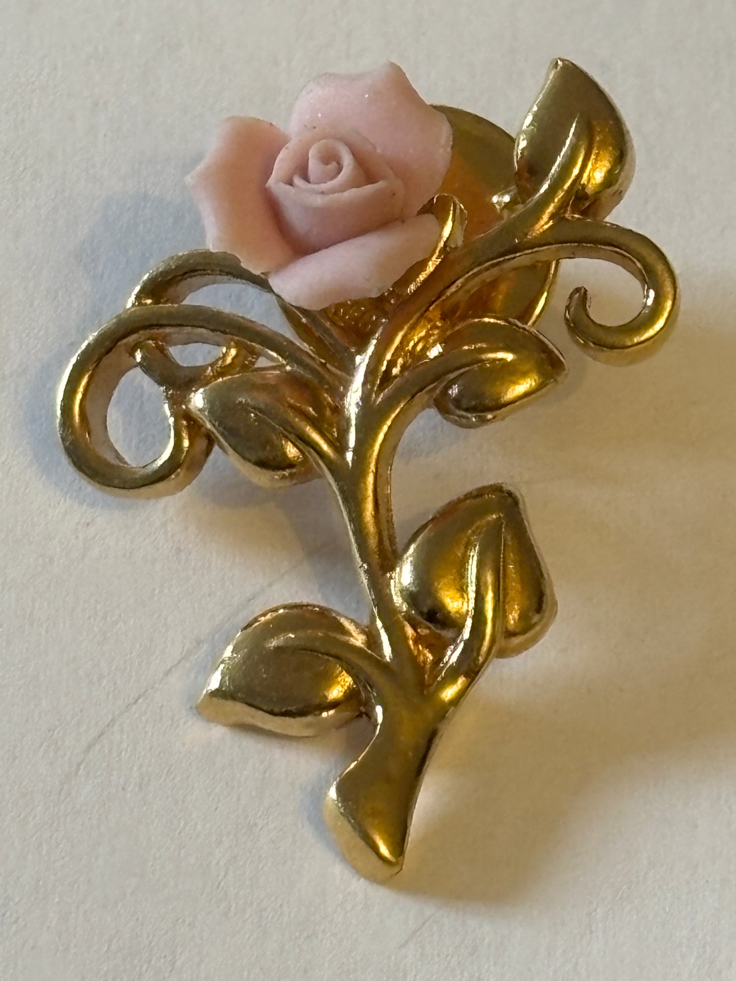 Gold metal and pink rose brooch