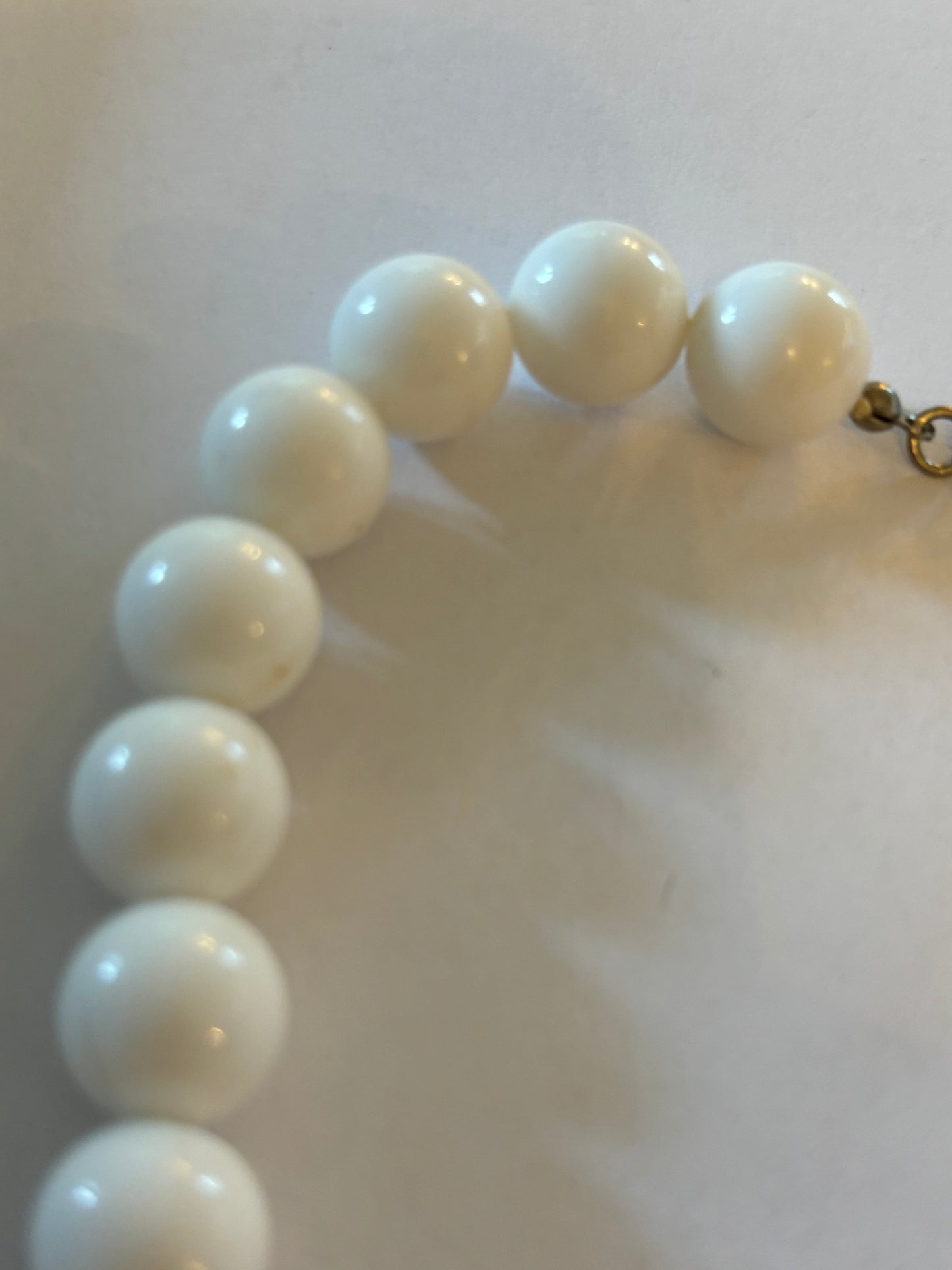 White and tube like large beaded necklace