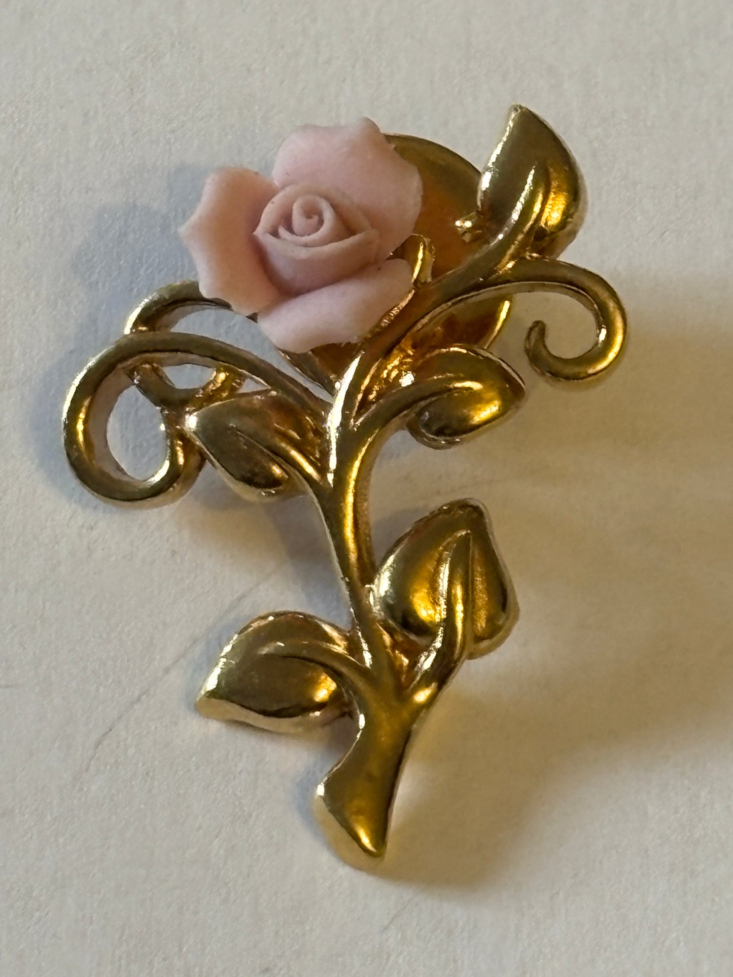 Gold metal and pink rose brooch