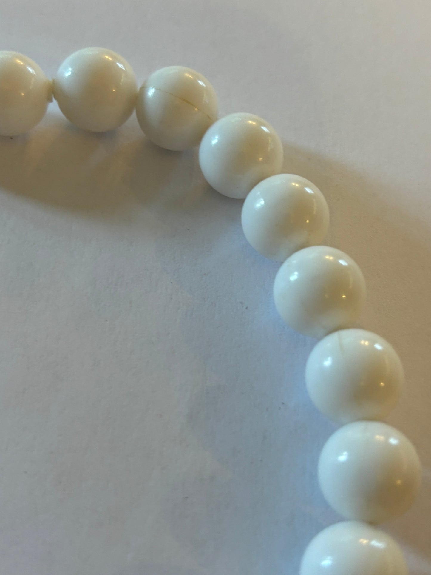 White and tube like large beaded necklace