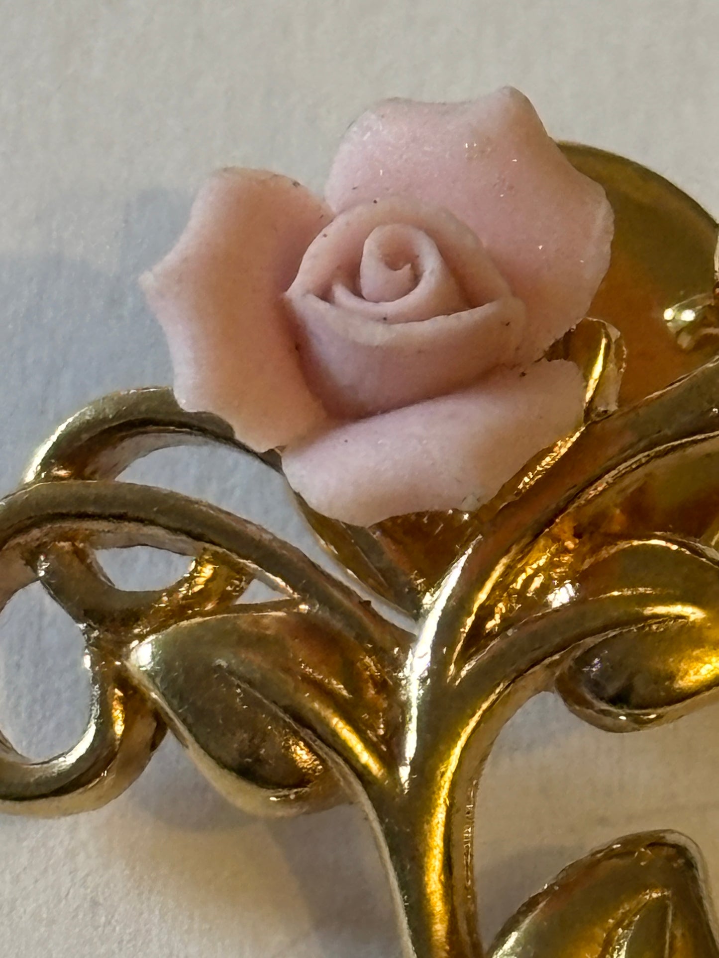 Gold metal and pink rose brooch