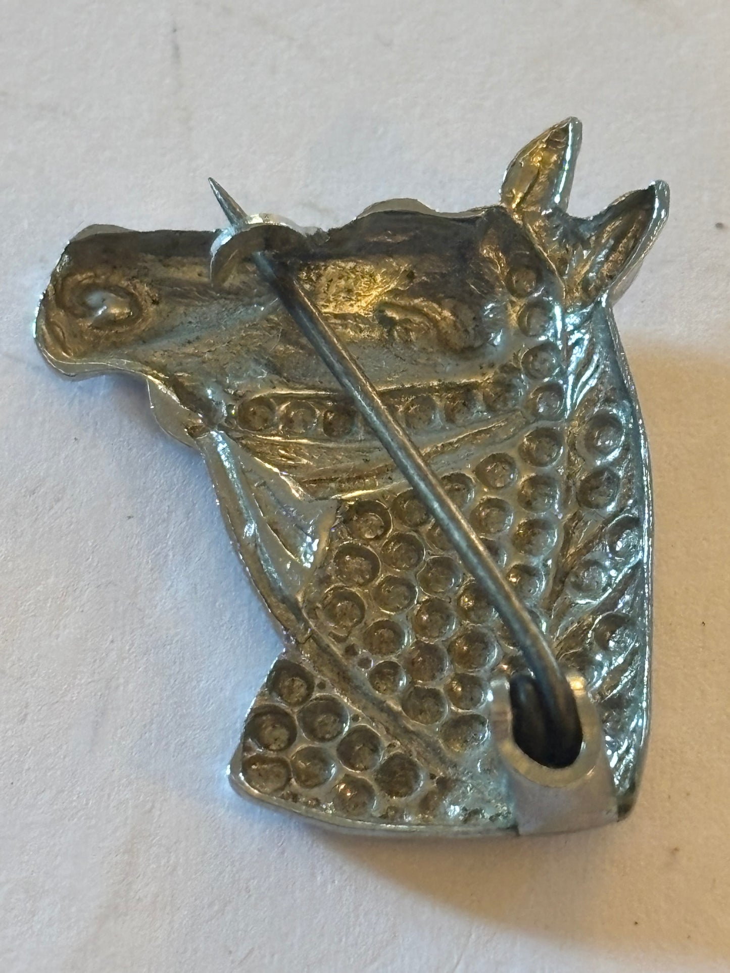 Silver horse head brooch