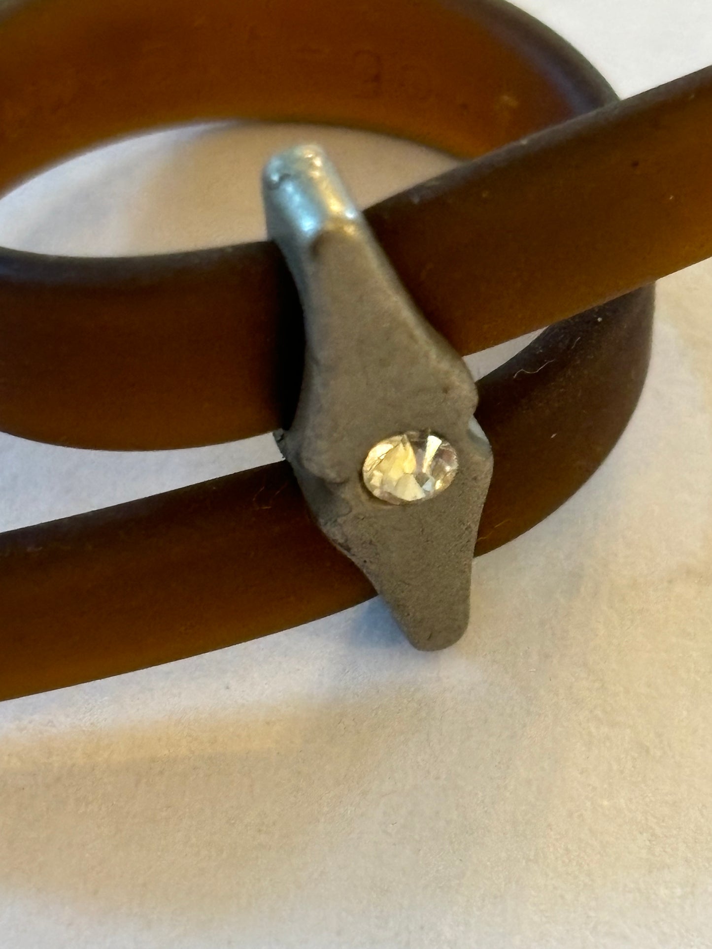 Brown rubber wrap ring, belt style with silver centre and white stone