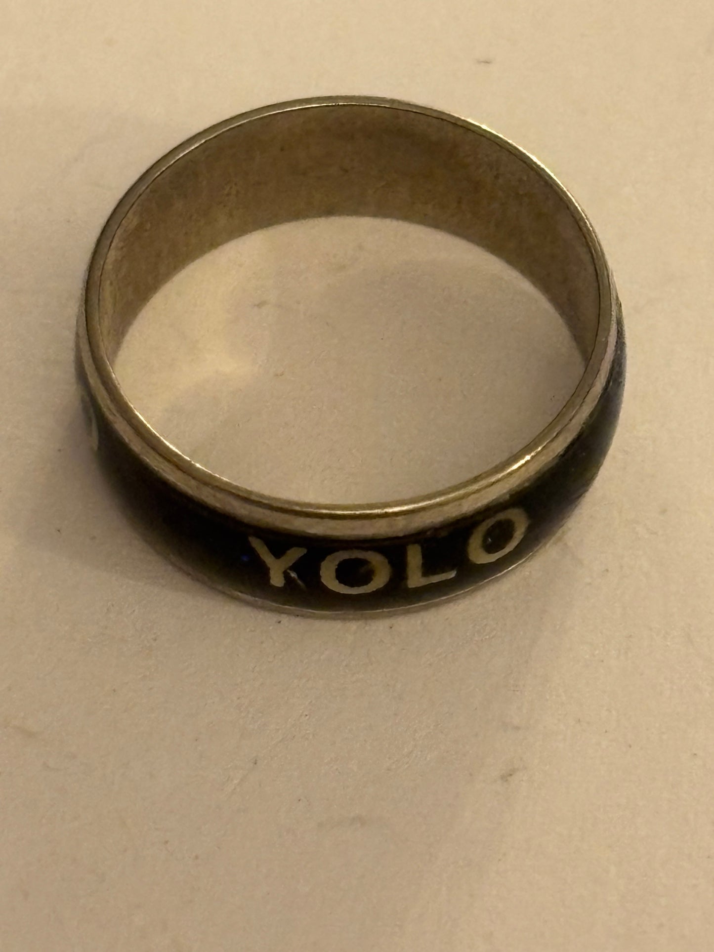 Silver and black band ring with YOLO message - Size K