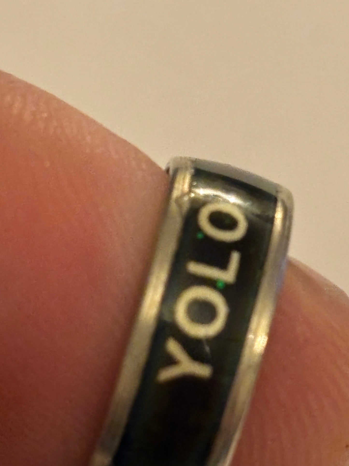 Silver and black band ring with YOLO message - Size K