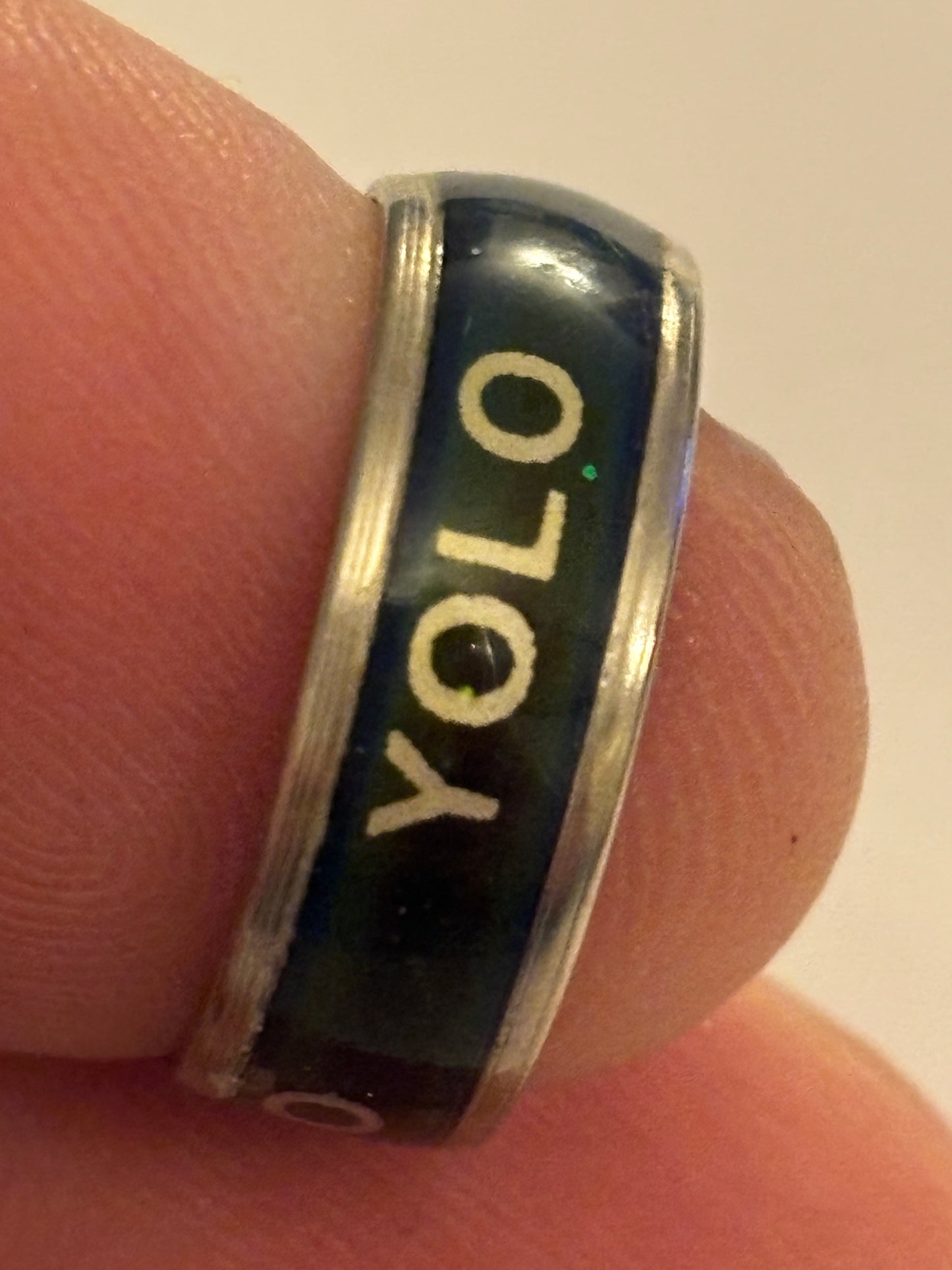 Silver and black band ring with YOLO message - Size K