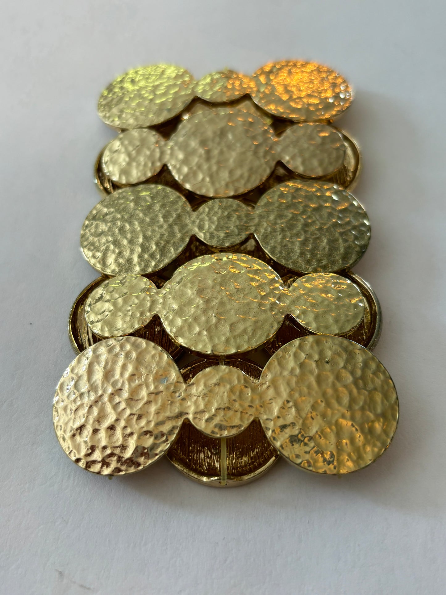 Heavy linked gold discs stretch bracelet