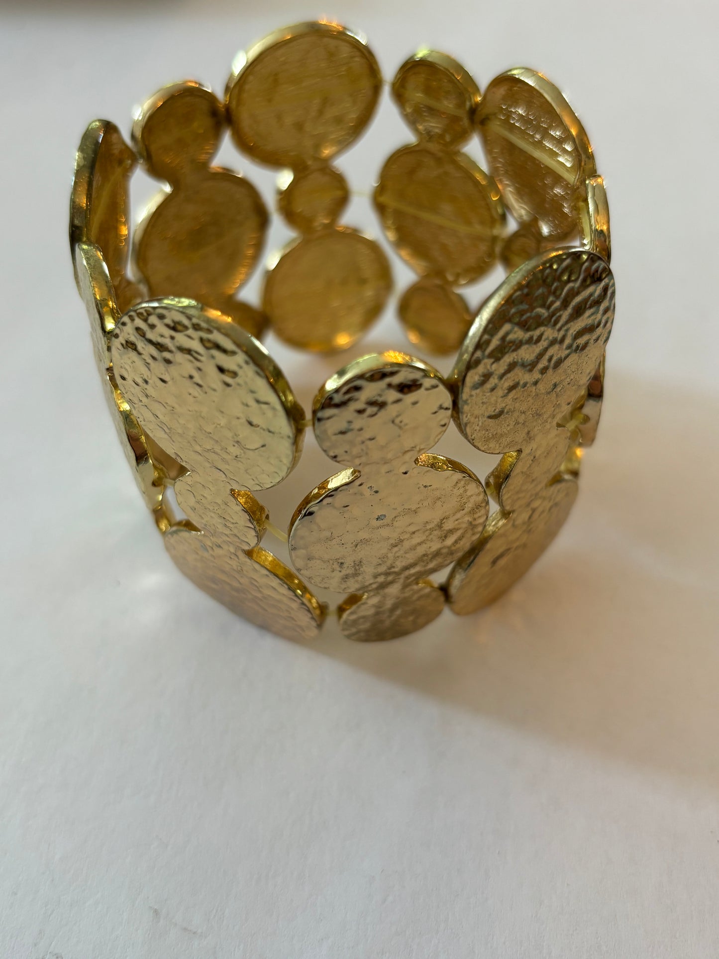 Heavy linked gold discs stretch bracelet