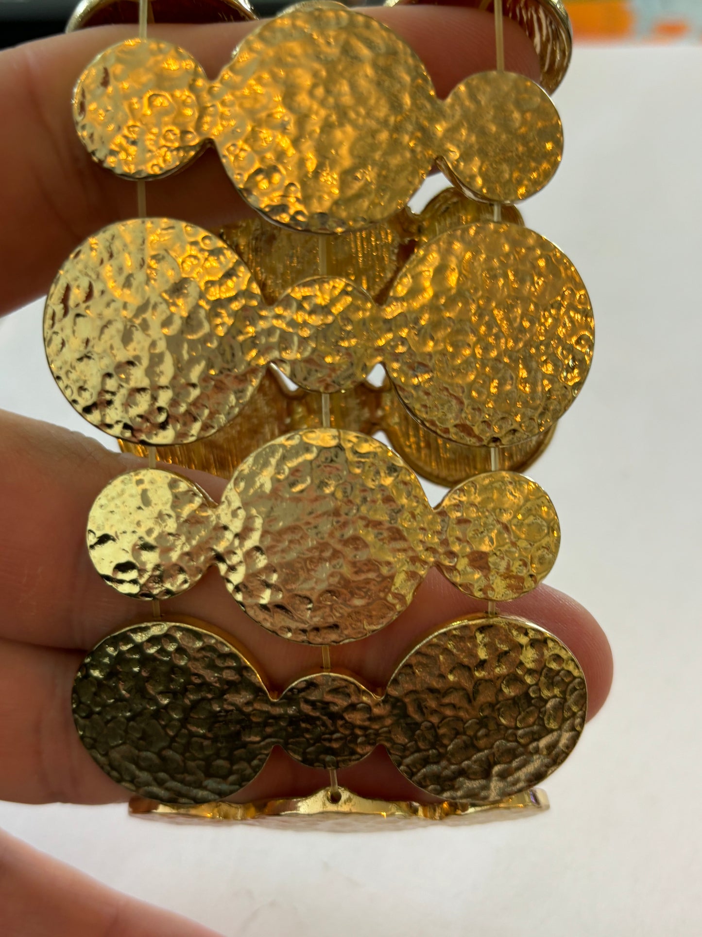 Heavy linked gold discs stretch bracelet