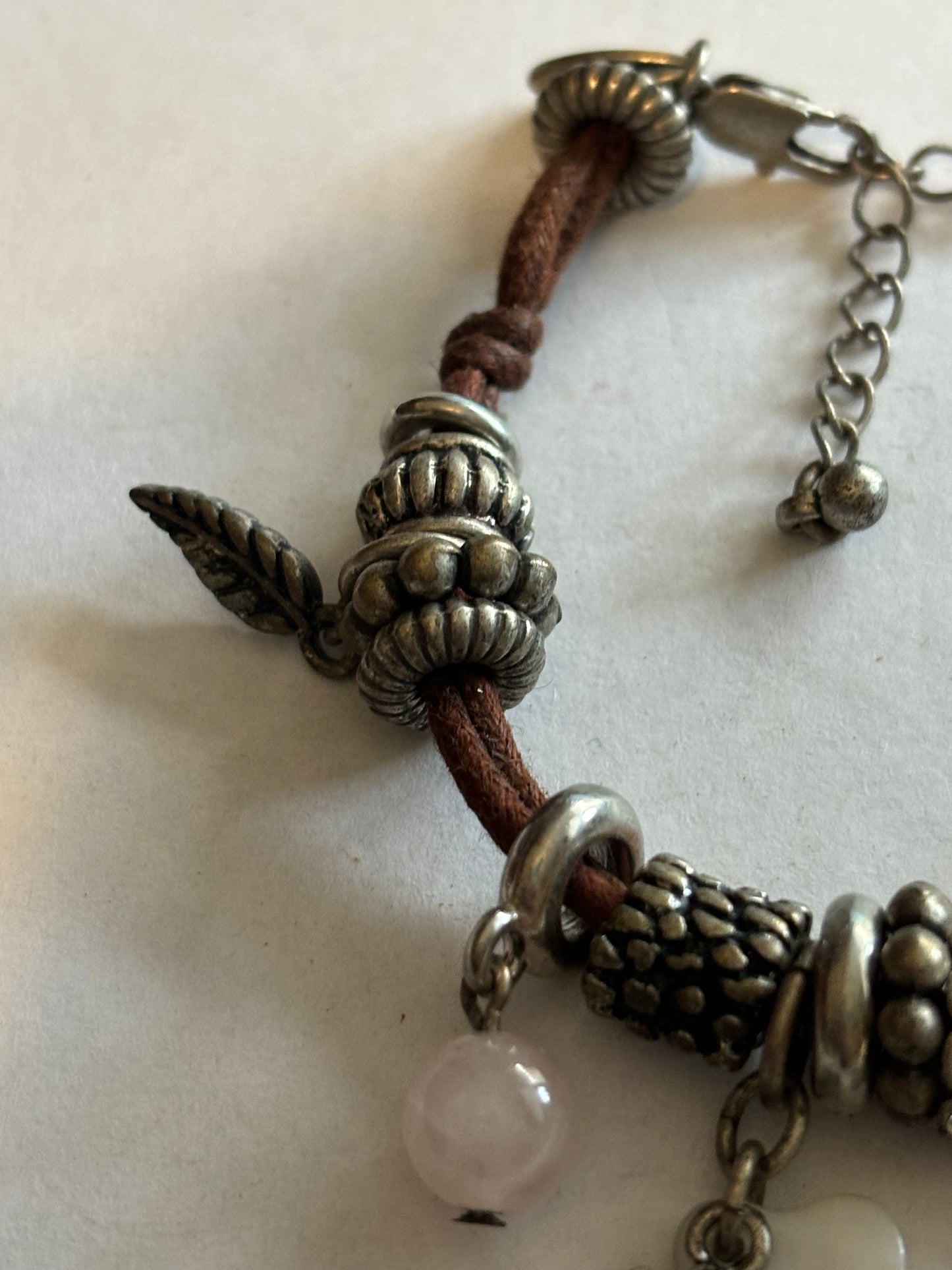 NEXT - Brown string and silver charm bracelet