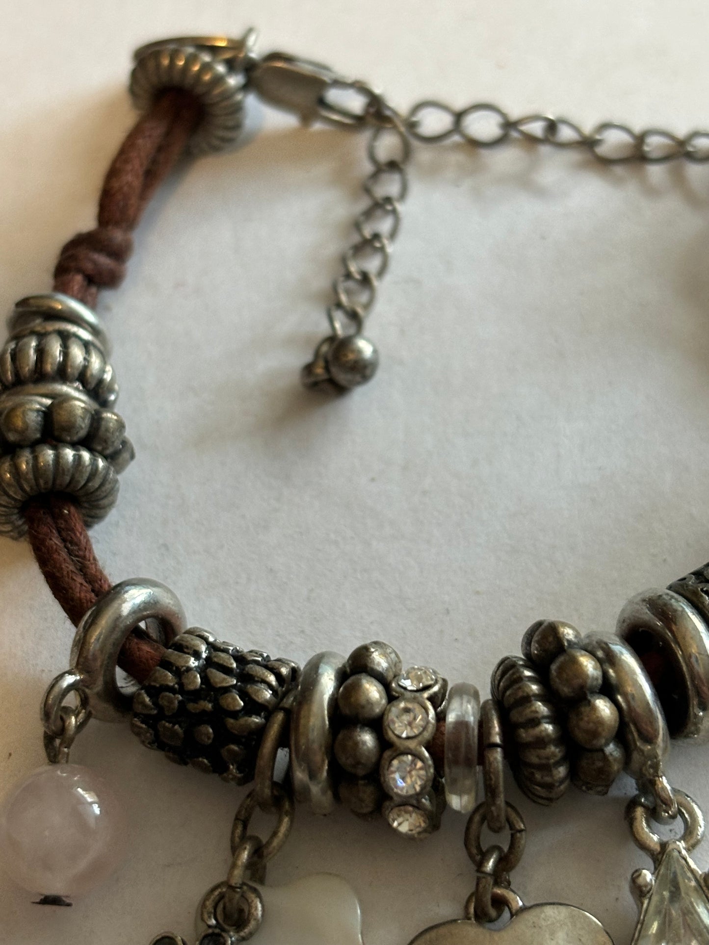 NEXT - Brown string and silver charm bracelet