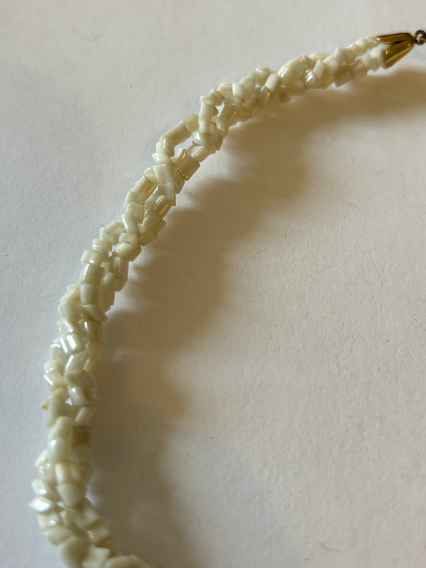 Triple twisted rocky white bead necklace