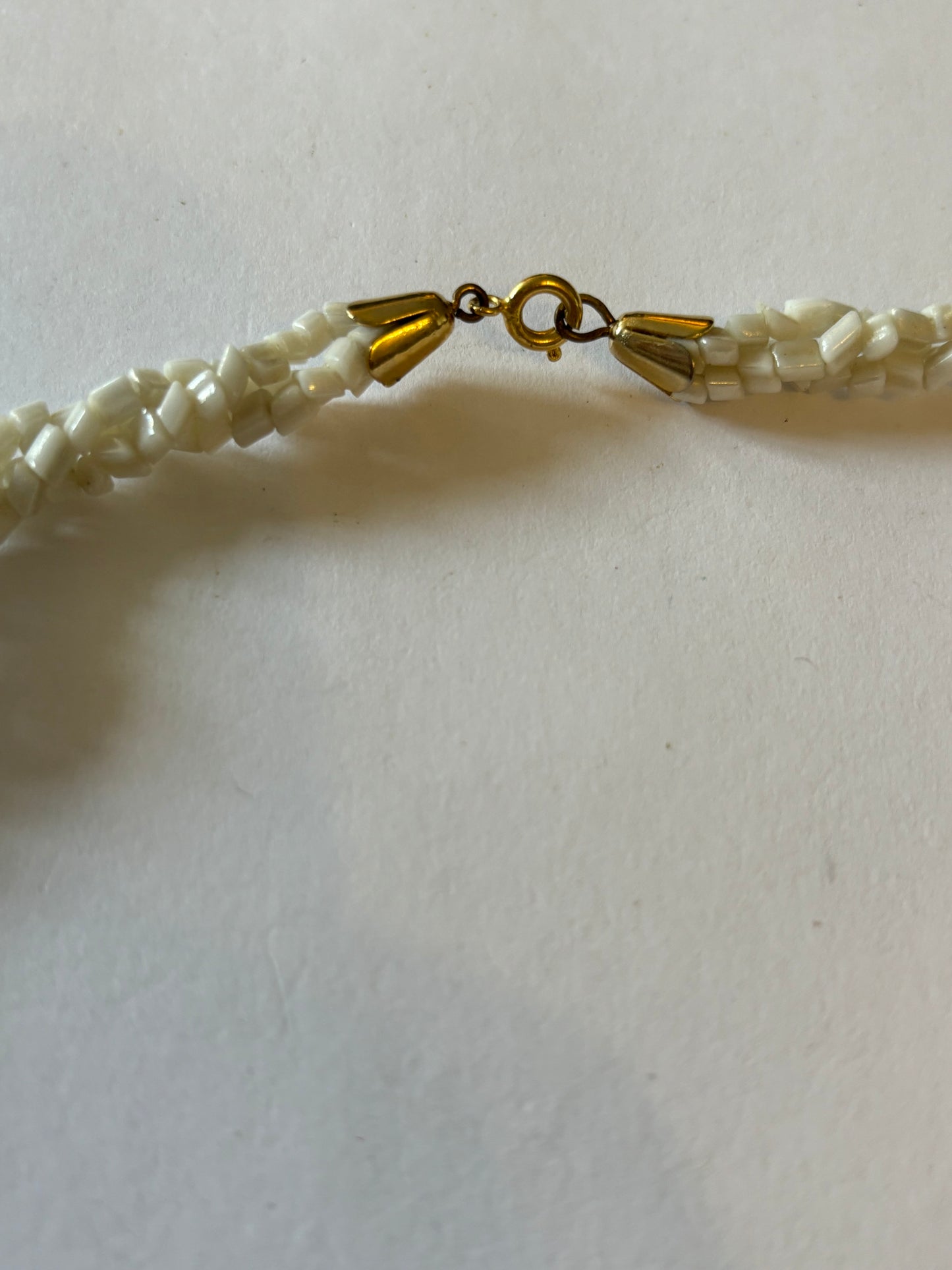 Triple twisted rocky white bead necklace