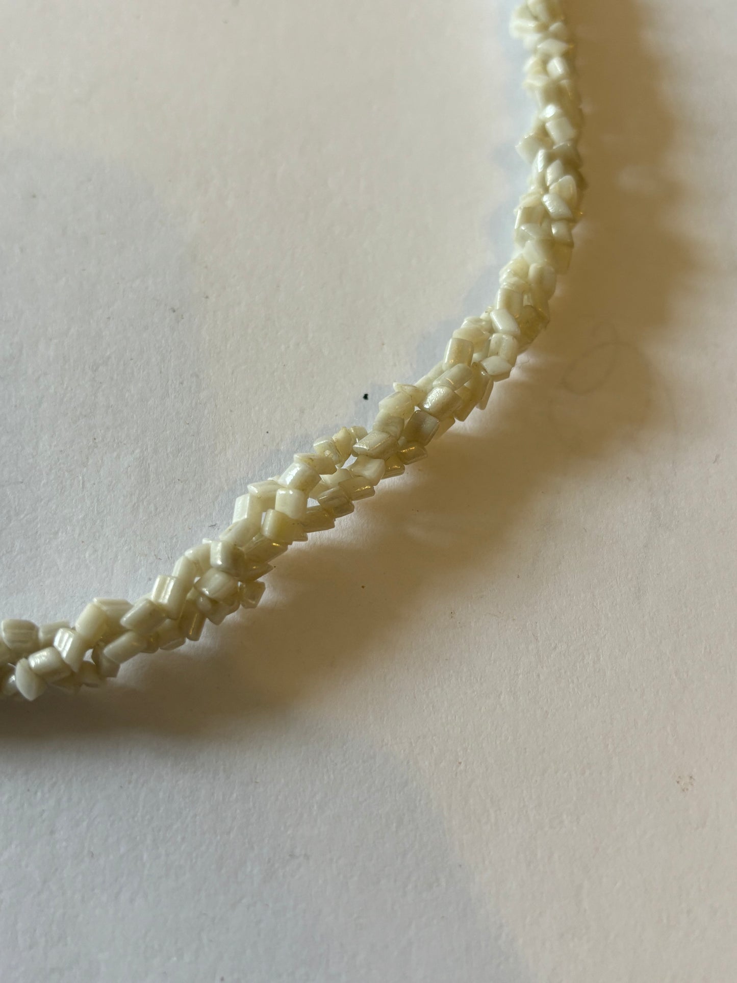 Triple twisted rocky white bead necklace