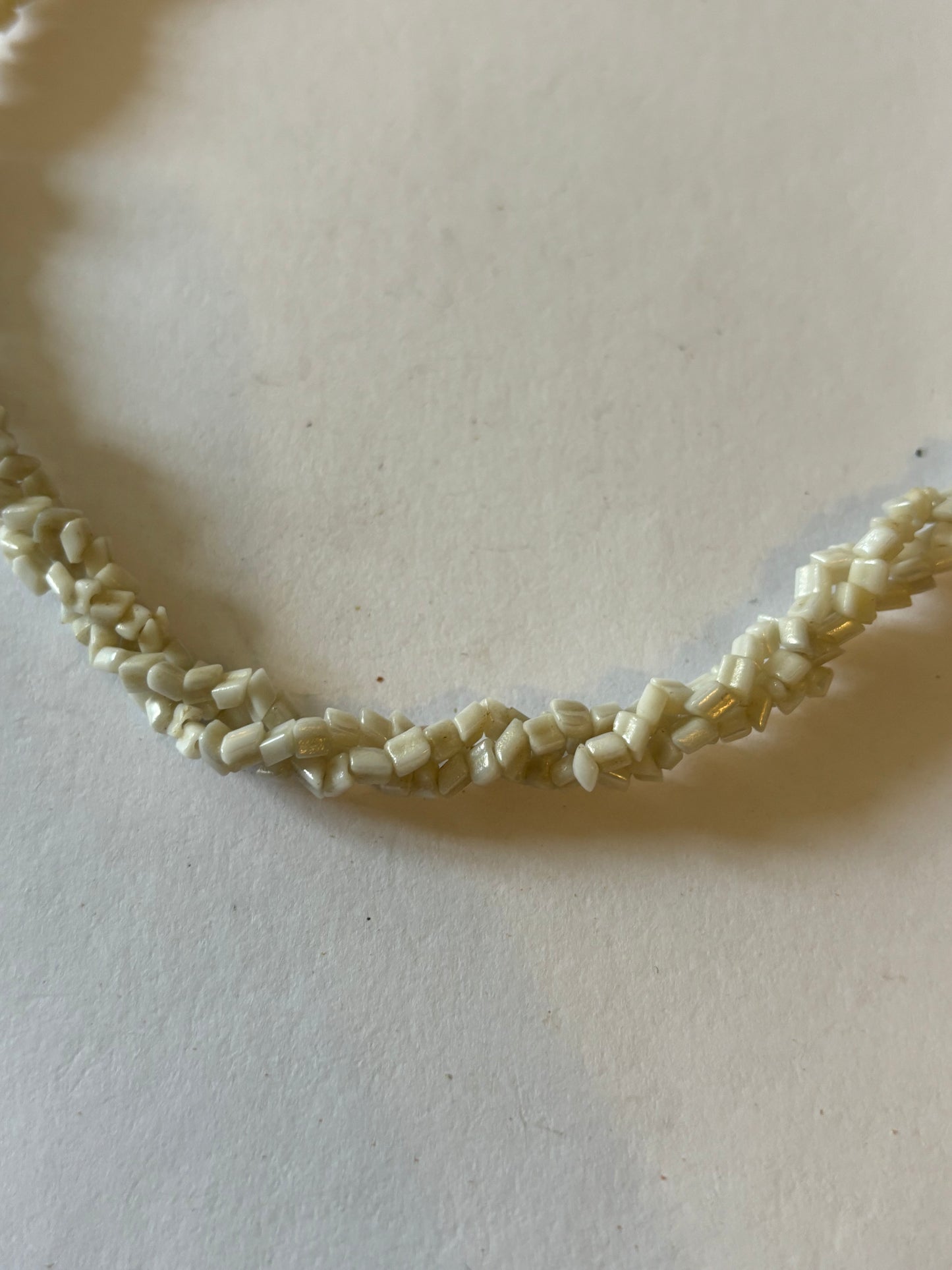 Triple twisted rocky white bead necklace