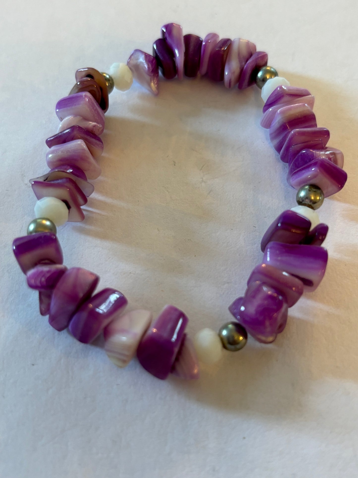 Purple and white uneven bead bracelet