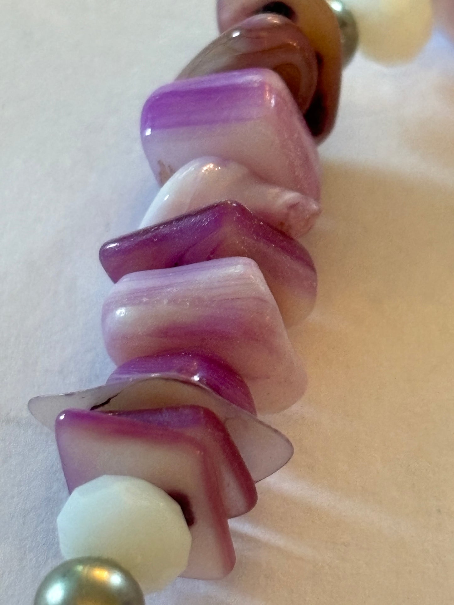 Purple and white uneven bead bracelet