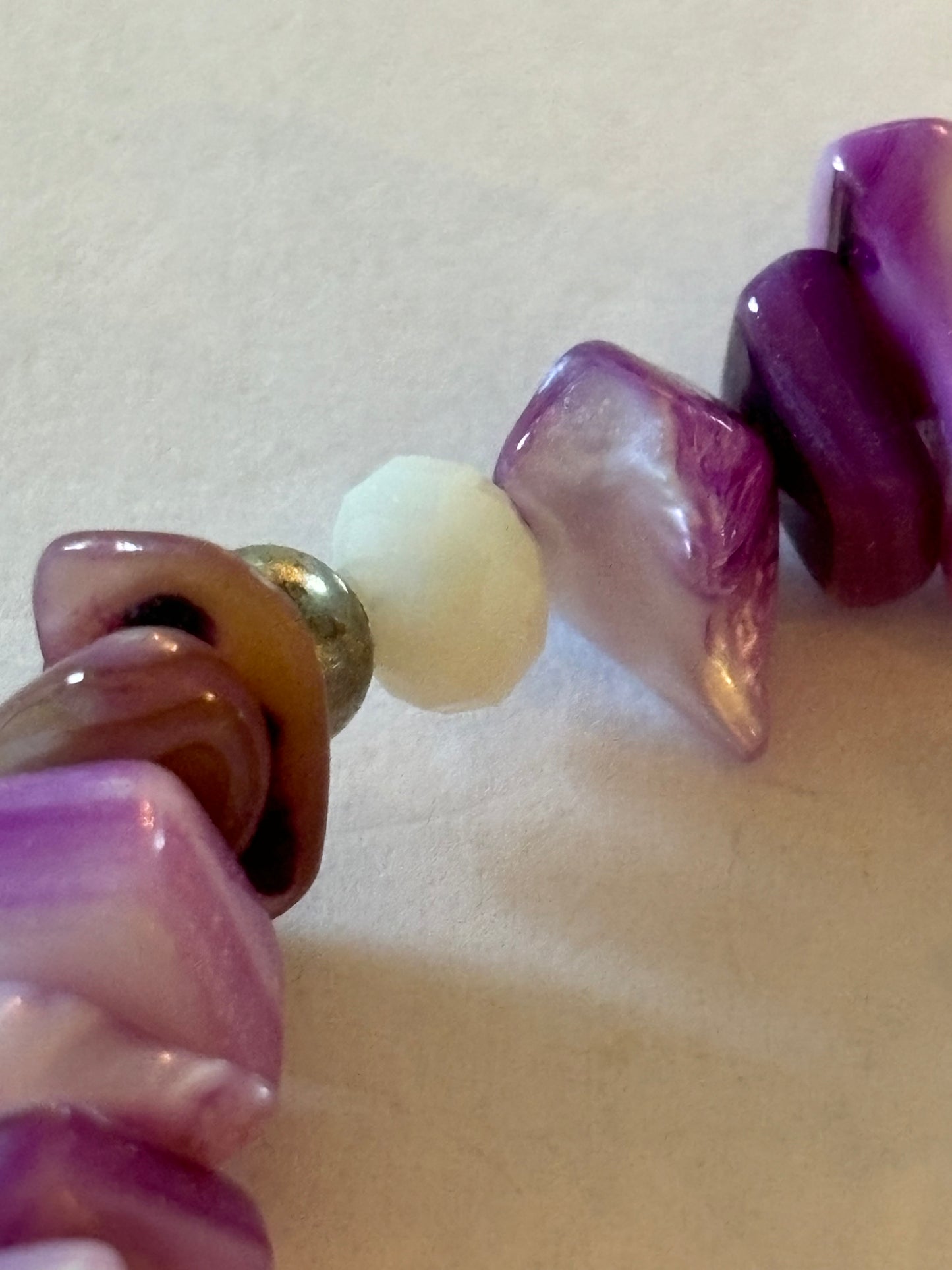 Purple and white uneven bead bracelet