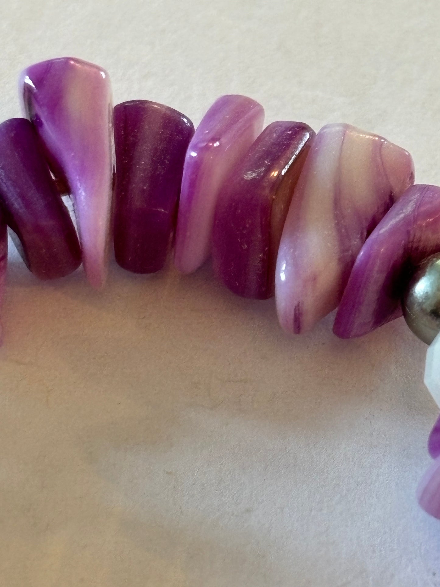 Purple and white uneven bead bracelet