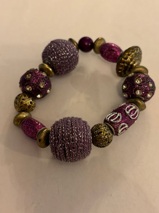 Ornate gold purple decorative bead bracelet