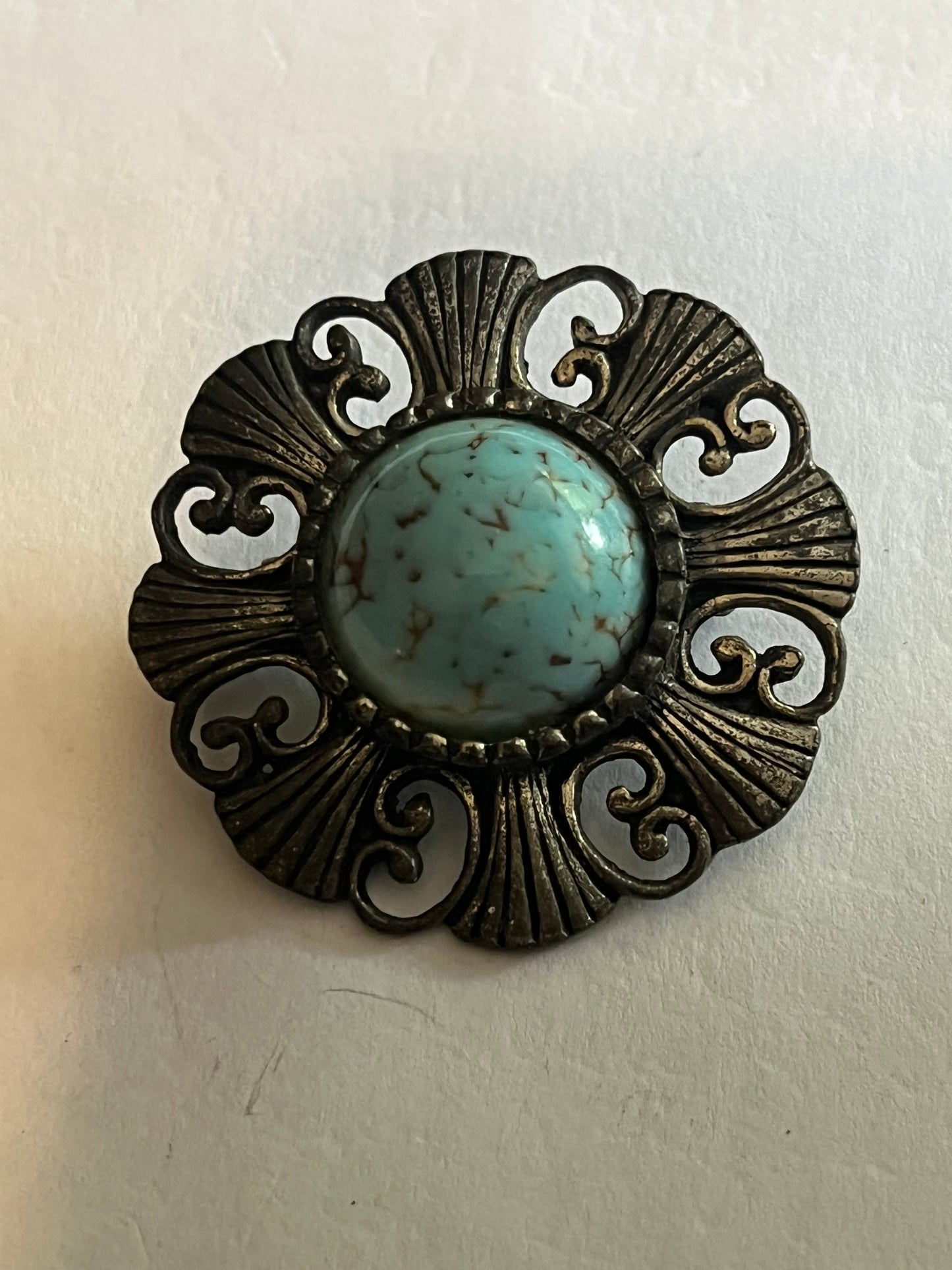 Round Ornate Silver metal brooch with marbled turquoise centre