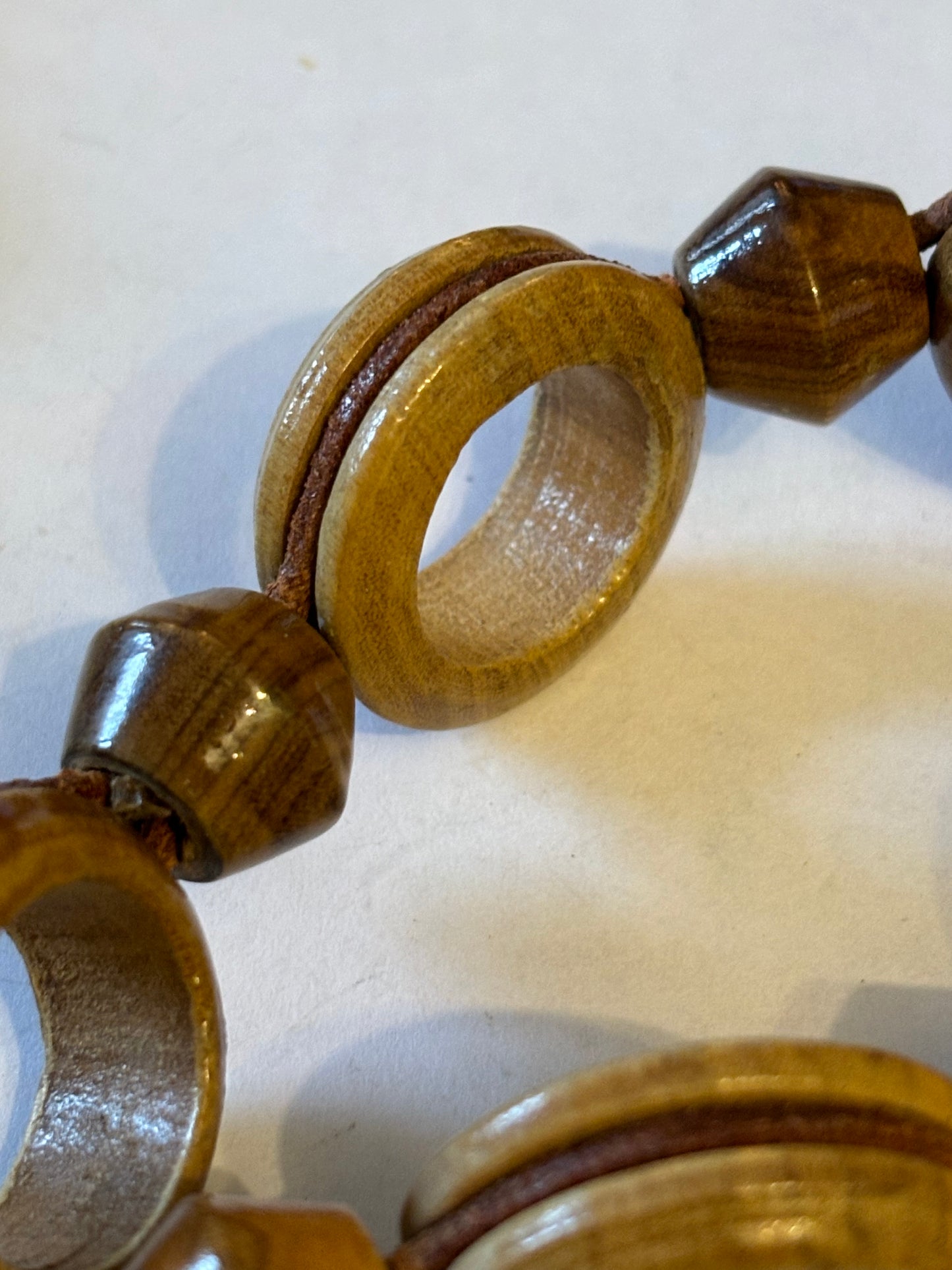 Very long glossy wooden rings and bead necklace