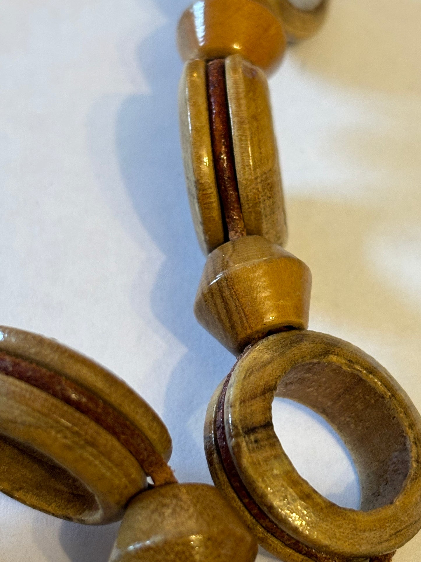 Very long glossy wooden rings and bead necklace