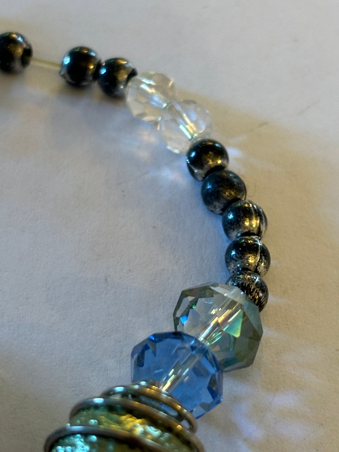 Silver, clear blue and gold beaded bracelet